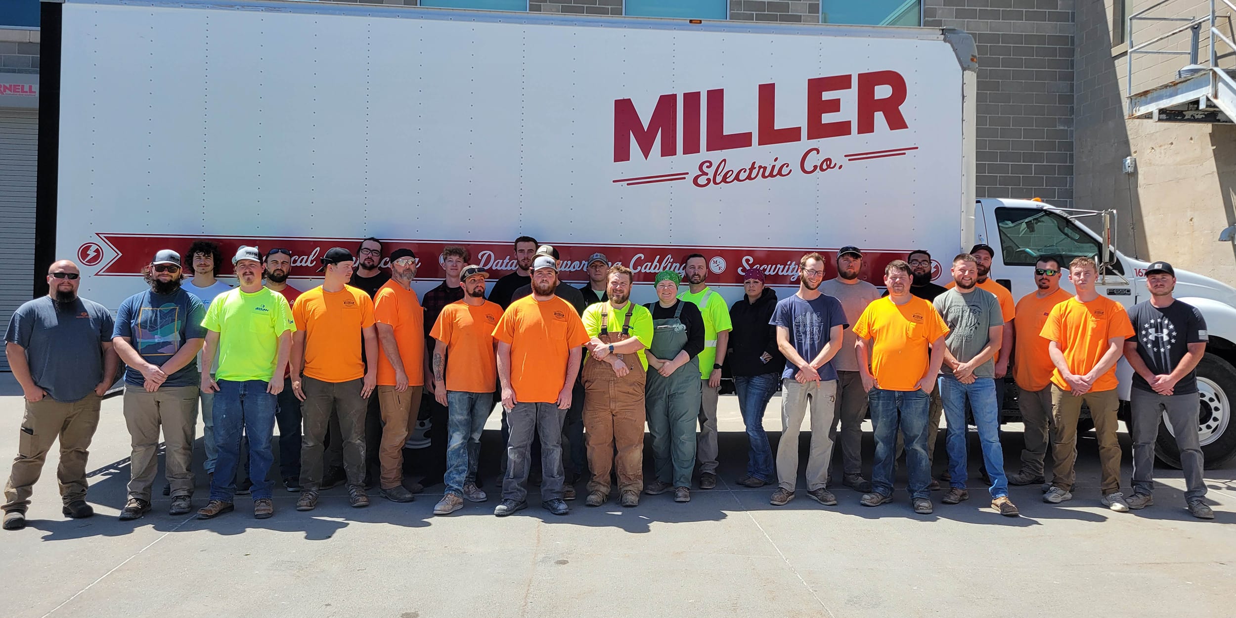 Miller apprentices in front of Miller truck